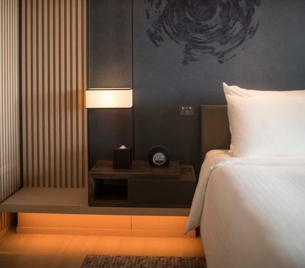 Mu Jiaoxi Hotel Экстерьер фото A room at the hotel