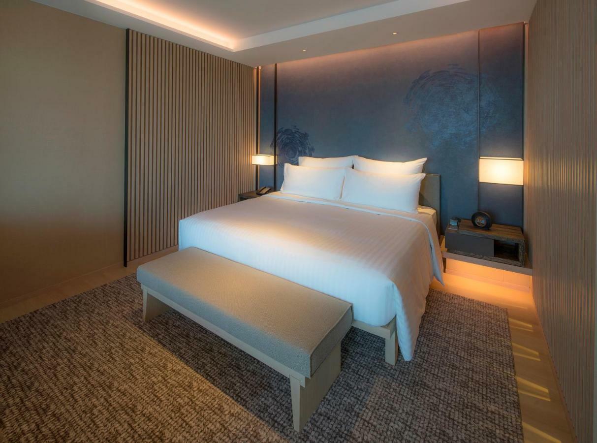 Mu Jiaoxi Hotel Экстерьер фото A bedroom at the hotel